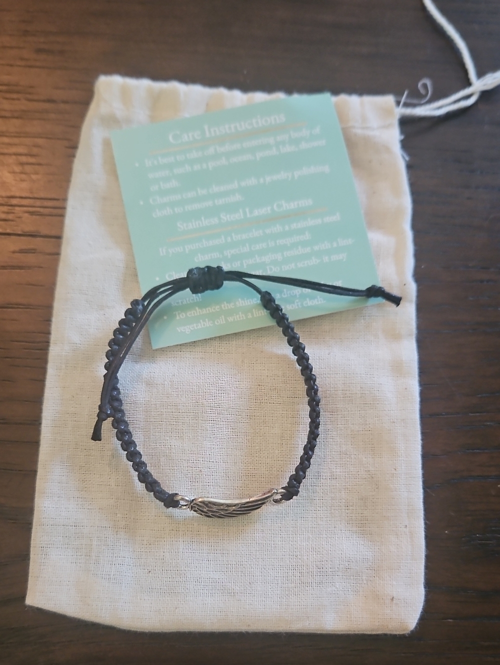 NWT Braided Black Cord Bracelet with Silver Feather Accent